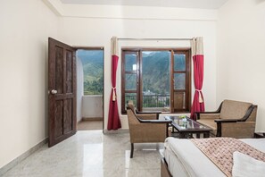 Deluxe Room With Garden View | Premium bedding, desk, laptop workspace, free WiFi - Hotel Sun Village by Palm Aryan (Mussoorie)