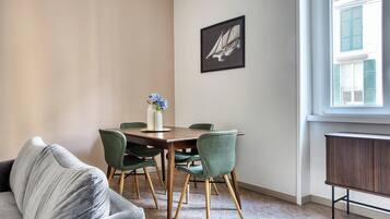 Deluxe Apartment, City View | Living area | 32-inch LED TV with digital channels