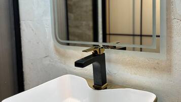 Shower, hair dryer, slippers, towels