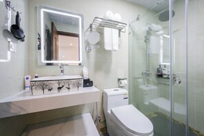 Shower, hair dryer, slippers, towels