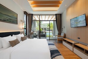 Deluxe tweepersoonskamer | Een kluis op de kamer, beddengoed