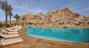 2 outdoor pools, open 8:00 AM to 6:00 PM, pool umbrellas