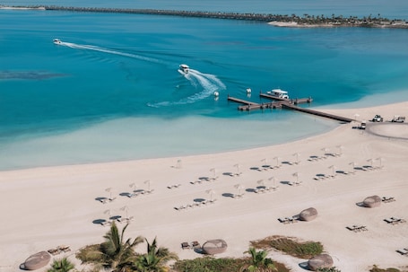 On the beach, beach umbrellas, beach bar. Turtle Bay Hotel