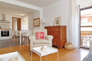 Apartment (3 Bedrooms) | Living area | 32-inch Smart TV with cable channels