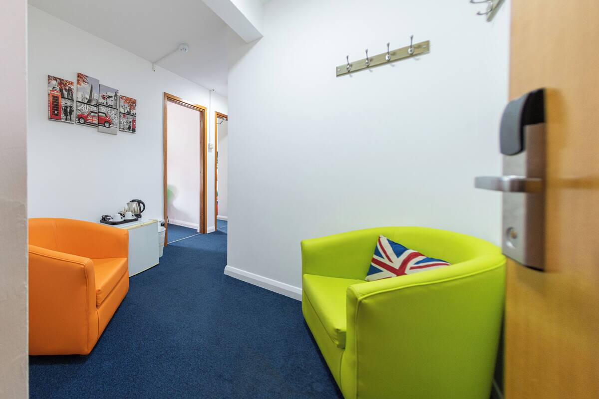 family room with the bathroom room 28 | Blackout drapes, iron/ironing board (on request), cribs (free)