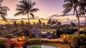 A landscaped garden with a swimming pool, palm trees, and a house with a dark roof. - Walk to MK Beach! 🏝️ Private Pool 🏊‍♂️ Jacuzzi ♨️ Mauna Kea Resort (Waimea)