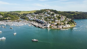 Overlooking a bustling marina, this charming town offers scenic views and easy access to the waterfront.