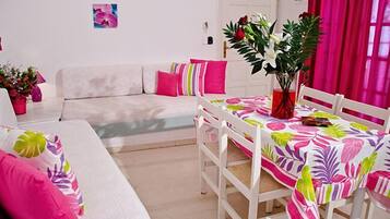 One Bedroom Quadruple Apartment | Living area