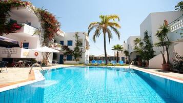Seasonal outdoor pool, open 8:30 AM to 7:30 PM, pool umbrellas