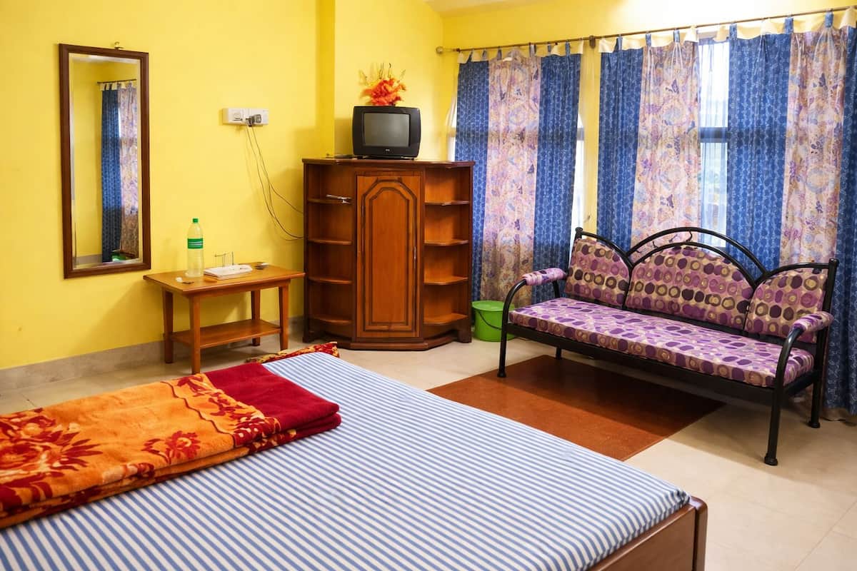 Desk, laptop workspace, bed sheets