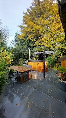Outdoor dining. Well-being and Nature: Le Cottage Exotique and its private Nordic bath with unlimited access