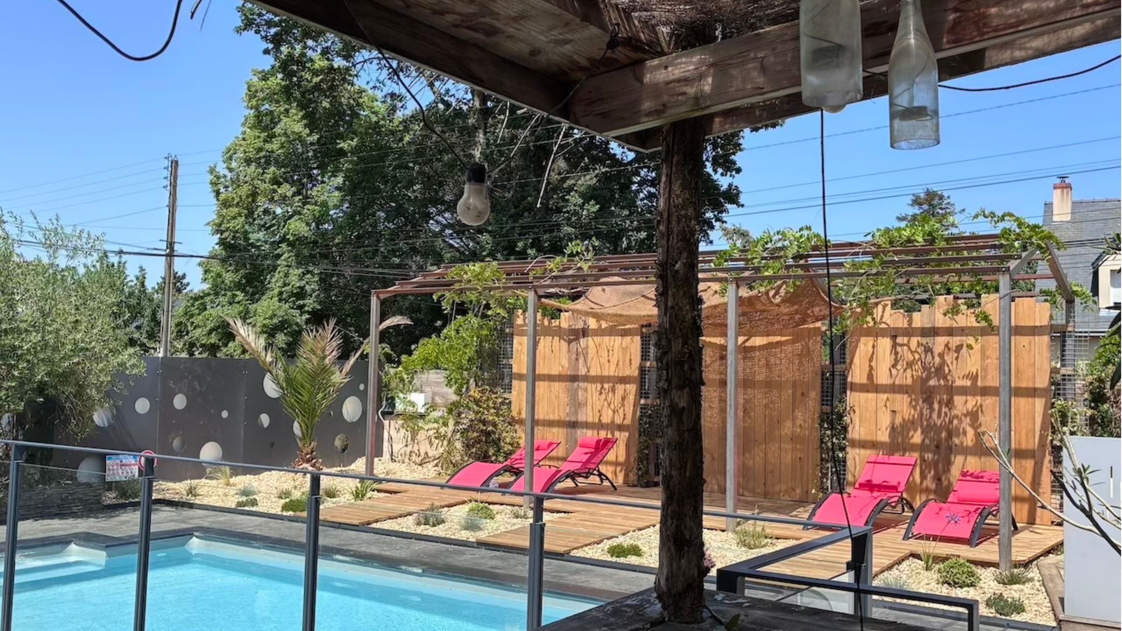 Outdoor pool, open 10:00 AM to 8:00 PM, pool umbrellas, pool loungers