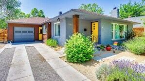 A two-story house with a garage, a front porch, and a well-maintained garden. - 24 Mi to Slopes! Family Reno Home w/ Outdoor Oasis (Reno)