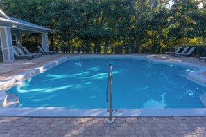 A swimming pool with a diving board, surrounded by lounge chairs and a covered seating area. - Aquamarine in The Preserve at Grayton - Included Golf Cart, Close to Pool! (Santa Rosa Beach)