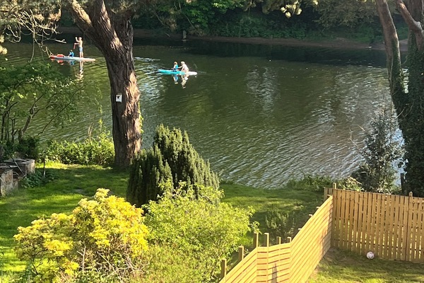 View from lounge window over looking garden down to the river