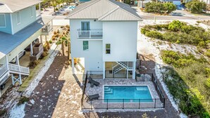 A two-story house with a pool, located near a beach with ocean views. - Private Pool | Pet Friendly | Sleeps 10 | Gulf Views (Cape San Blas)