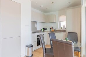 Coffee/tea maker, fridge, microwave, oven