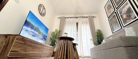Appartement Deluxe, vue sur le jardin | Aire de séjour