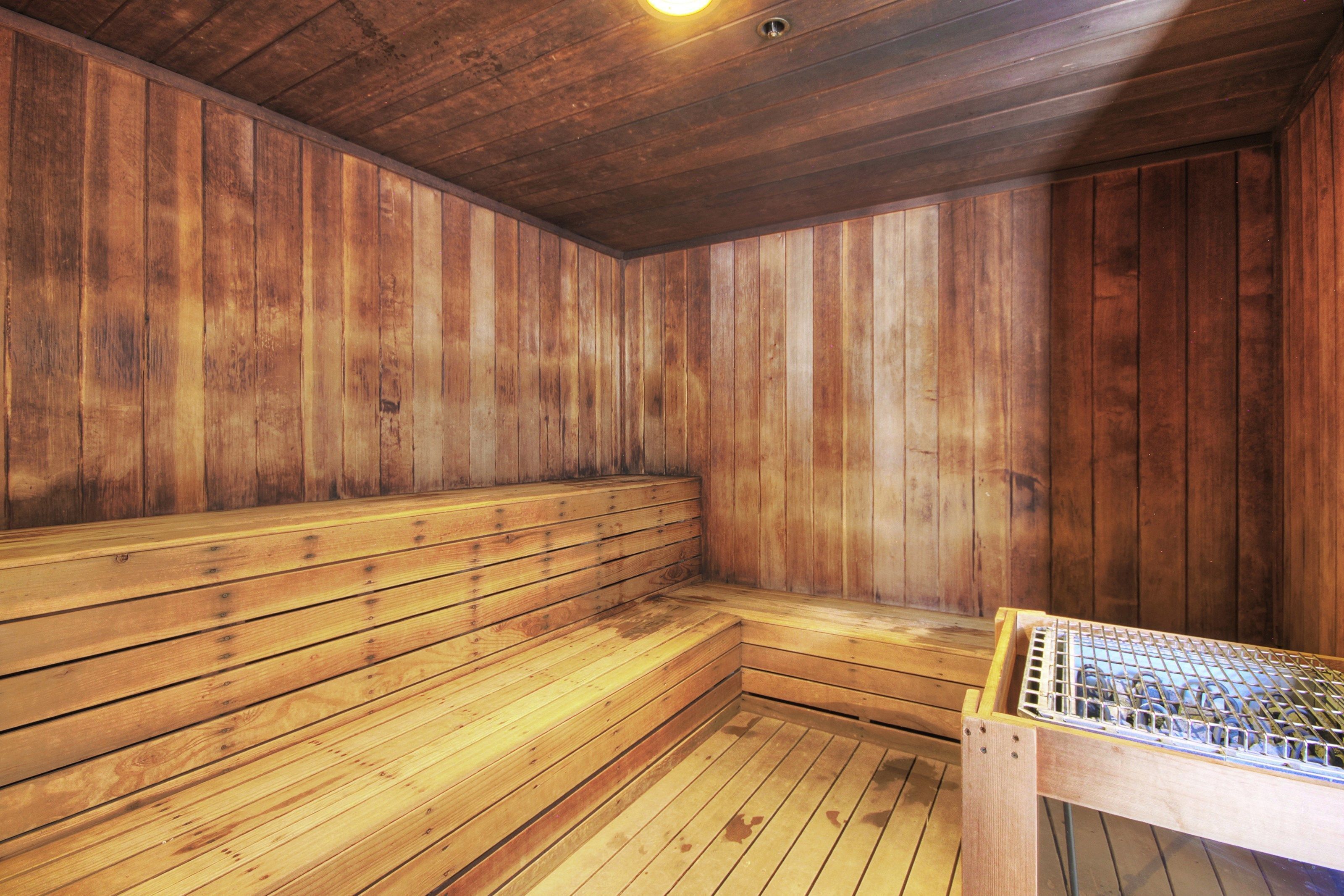 A sauna with wooden walls and benches.