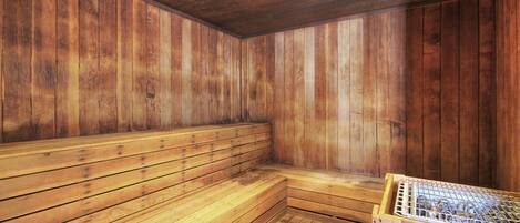 A sauna with wooden walls and benches.
