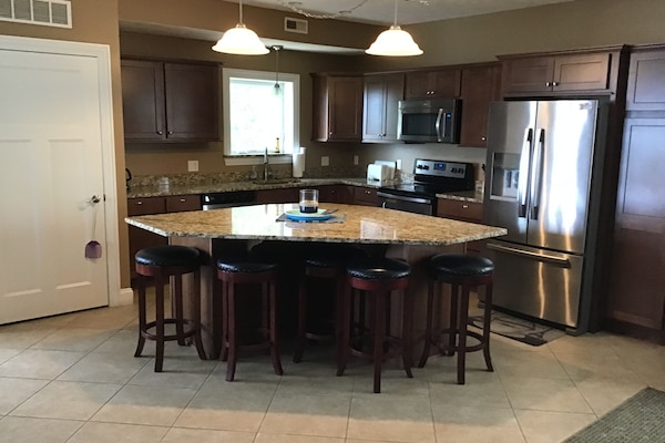 Open concept kitchen with stainless steel appliances