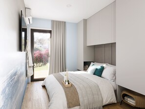 A modern bedroom with a large bed, a bedside table, a wicker chair, and a view of a garden through a window. - Amadria Exclusive Beach Villa (Sibenik)