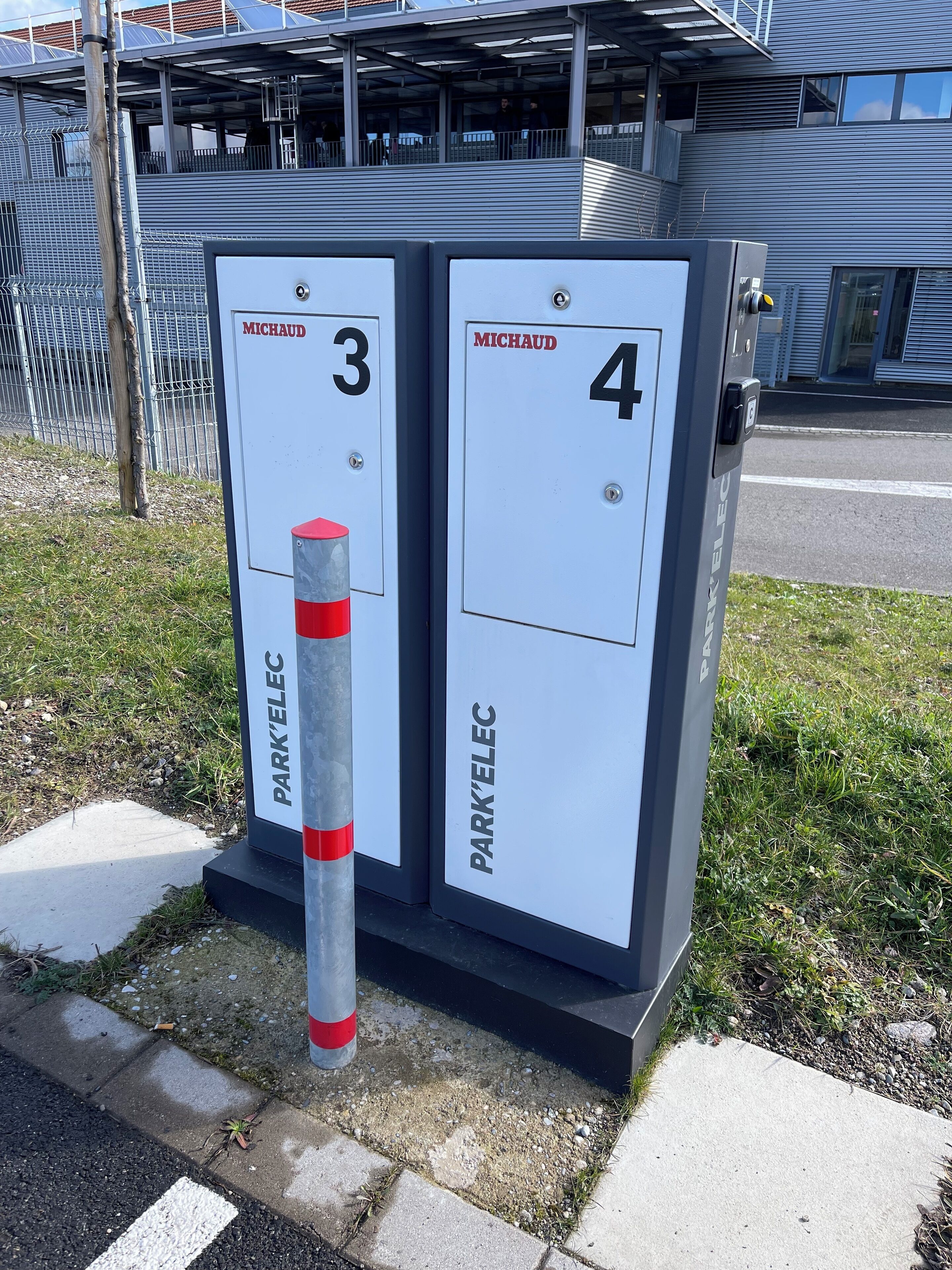 A utility box with two compartments labeled "MICHAUD 3" and "MICHAUD 4" for park and ride services.