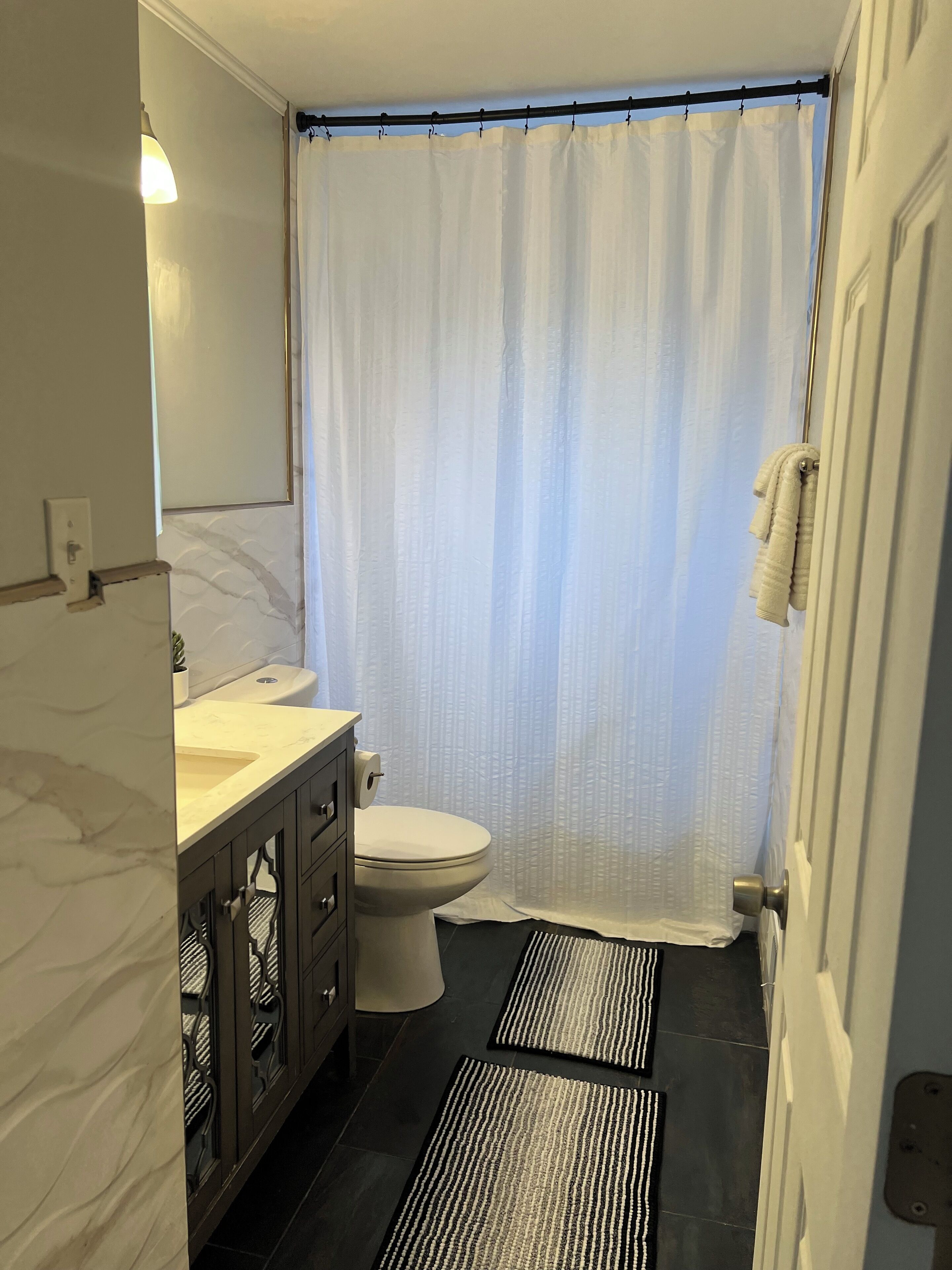 Bidet, towels, soap, toilet paper