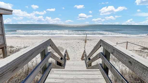 A wooden boardwalk leading to a beach with a clear view of the ocean and sky. - Ocean View-Pet Friendly- 1min walk to beach-sleeps 6 (Surf City)