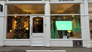 A building with a sign reading 'THE SALISBURY LUXURY HOLIDAY APARTMENTS' and a website address. - The Salisbury Apartment 106 (Scarborough)