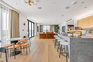 Enjoy a spacious room with a dining area, seating area, and well-equipped kitchen.