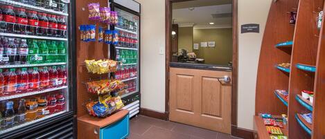 A vending area with various snacks and drinks.