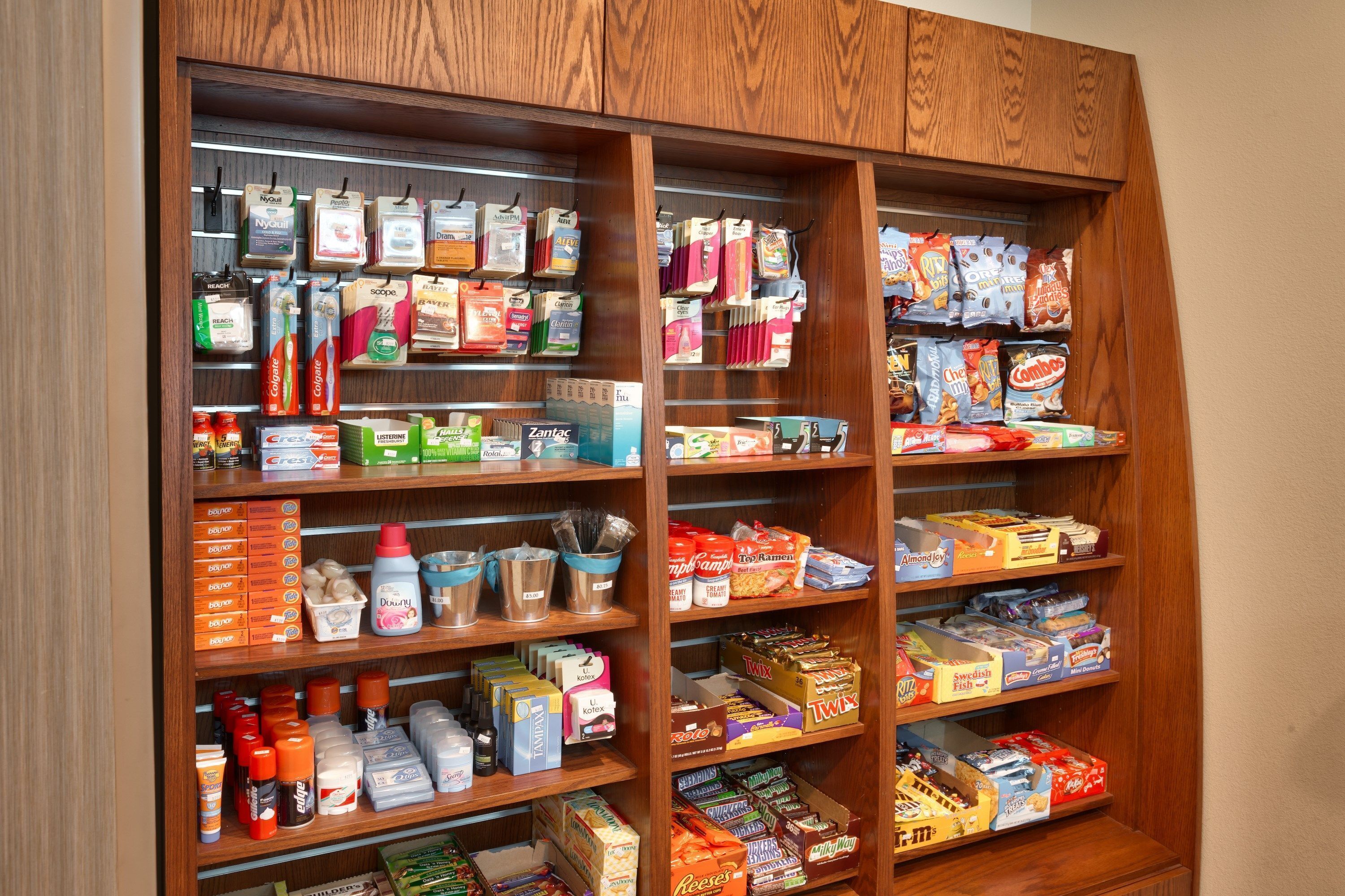 A well-organized pantry with various food items and beverages.