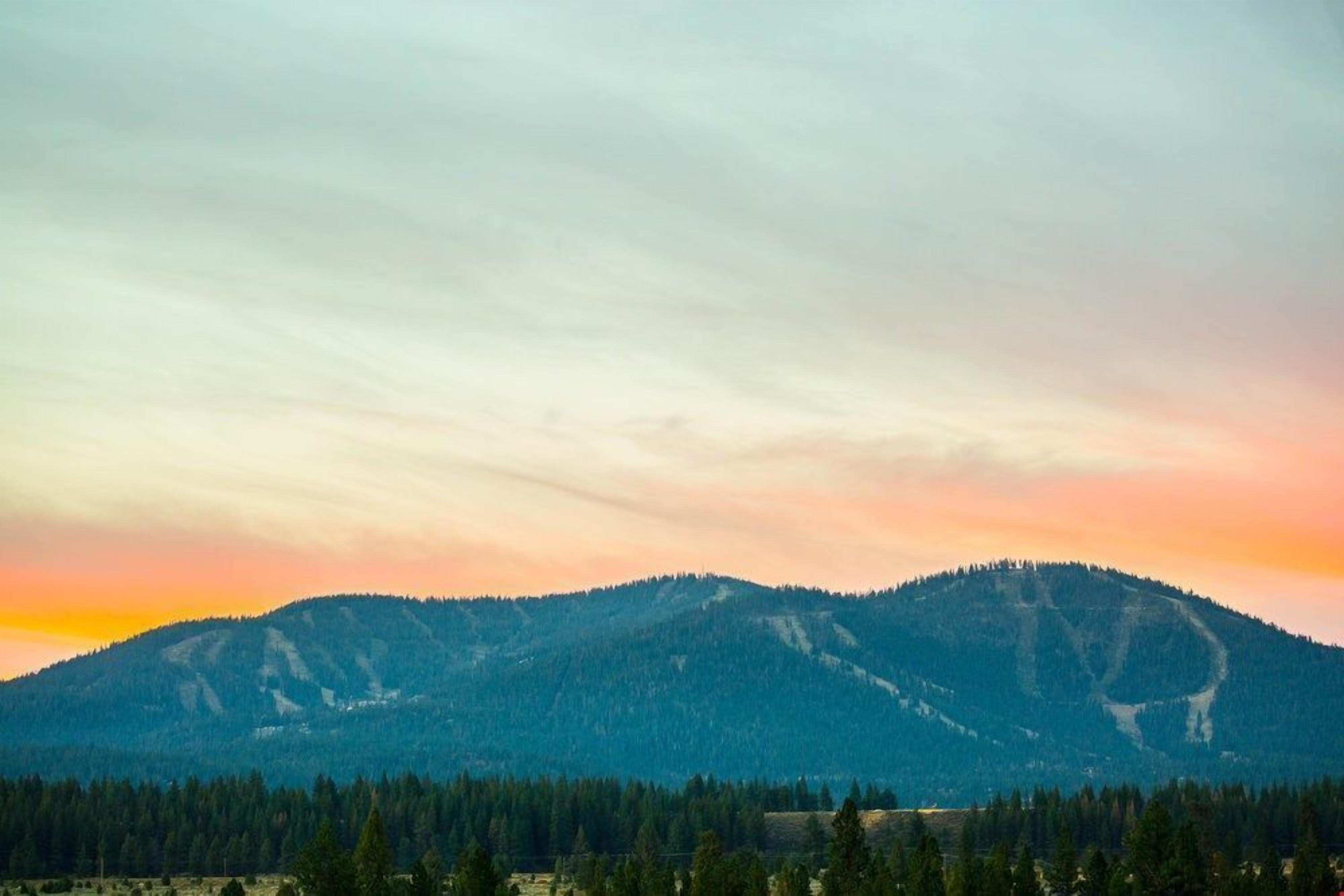 A mountain landscape with a clear sky.