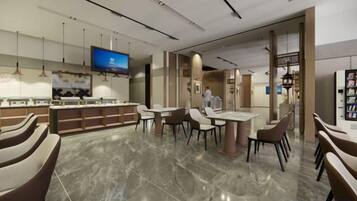 Un moderno vestíbulo de hotel con zona de bar, asientos y una pantalla de televisión.