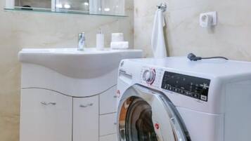 Hair dryer, towels, soap, shampoo