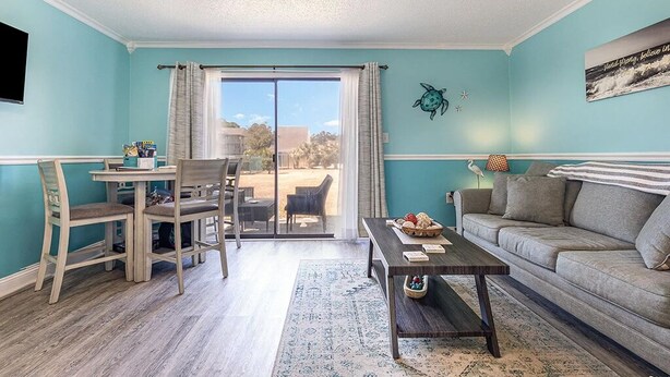 Living area - Cozy 1-bedroom condo with AC, WiFi in charming Little River. 3 miles from beach. (Little River)