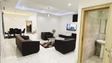 Economy Apartment, Balcony, City View | Living area | Flat-screen TV