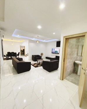 Economy Apartment, Balcony, City View | Living area | Flat-screen TV - Merryway Apartment (Abuja)