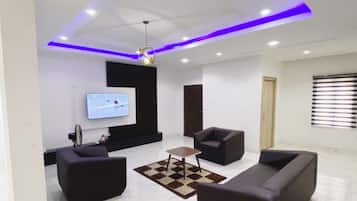 Economy Apartment, Balcony, City View | Living area | Flat-screen TV
