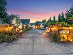 Stroll up to this charming home, surrounded by lush landscaping and a beautifully manicured entrance.