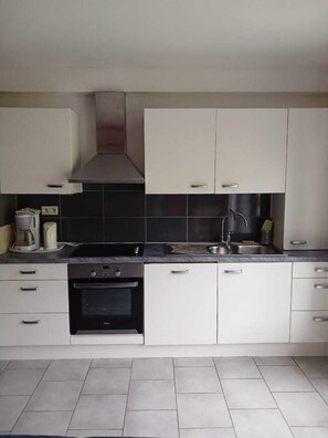 Apartment, 2 Bedrooms, Balcony, River View | Private kitchen | Highchair - Presqu'île de Chooz (Chooz)
