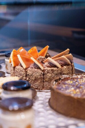 A variety of desserts on a tray. - HOW Boutique and Hotel (Cluj-Napoca)