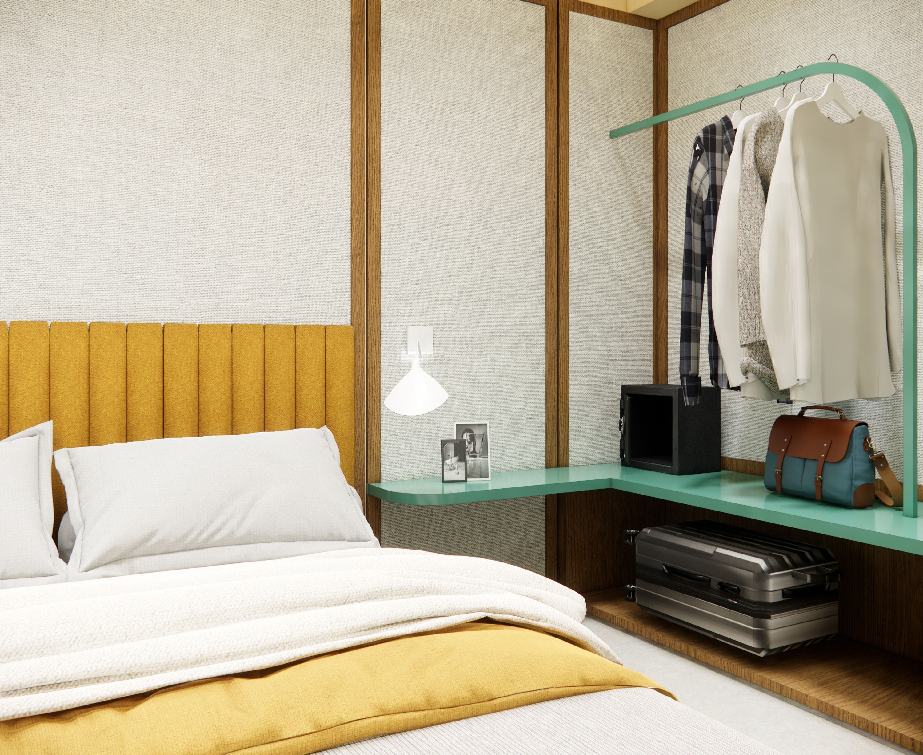 A neatly arranged hotel room with a bed, a bedside table with a lamp, a mirror, and a clothing rack with a suitcase.