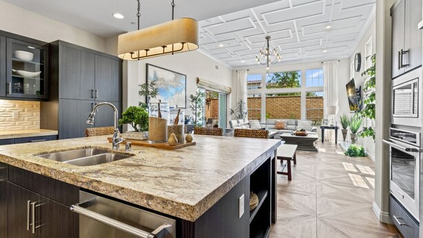 A spacious kitchen with granite countertops, stainless steel appliances, and a large island. - 2BR retreat - hot tub, gym & Coachella nearby (La Quinta)