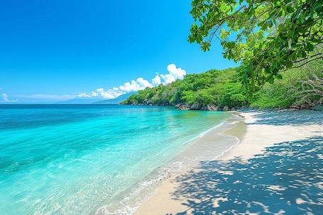 Beach nearby, white sand, sun loungers, beach umbrellas. Mauritius Rooms