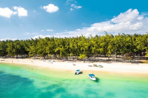 Beach nearby, white sand, sun loungers, beach umbrellas