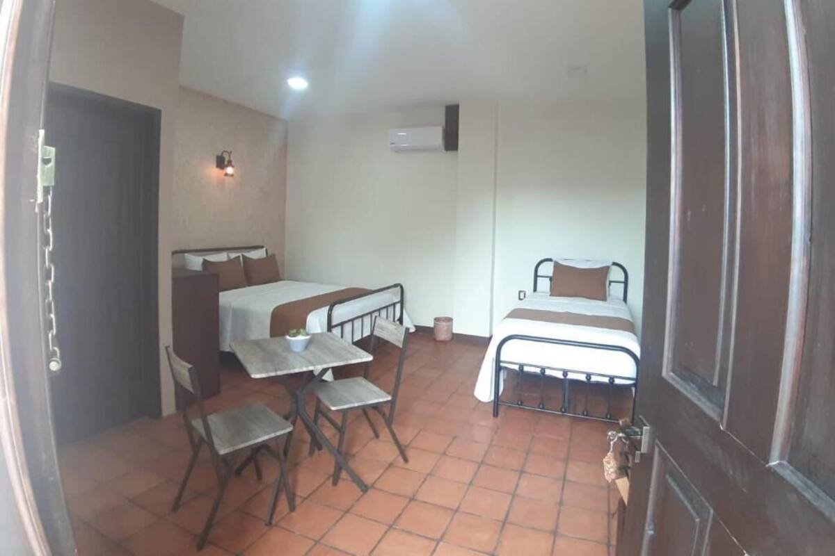 Triple Room, Balcony, Courtyard View | In-room safe, desk, laptop workspace, free WiFi