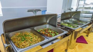 A buffet setup with various dishes in metal serving trays. - Hongxing Home Hotel (Nanning Wuyi store) (Nanning)