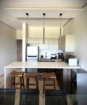 Fridge, microwave, stovetop, coffee/tea maker
